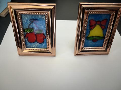 A picture of two faux stained glass art crafts