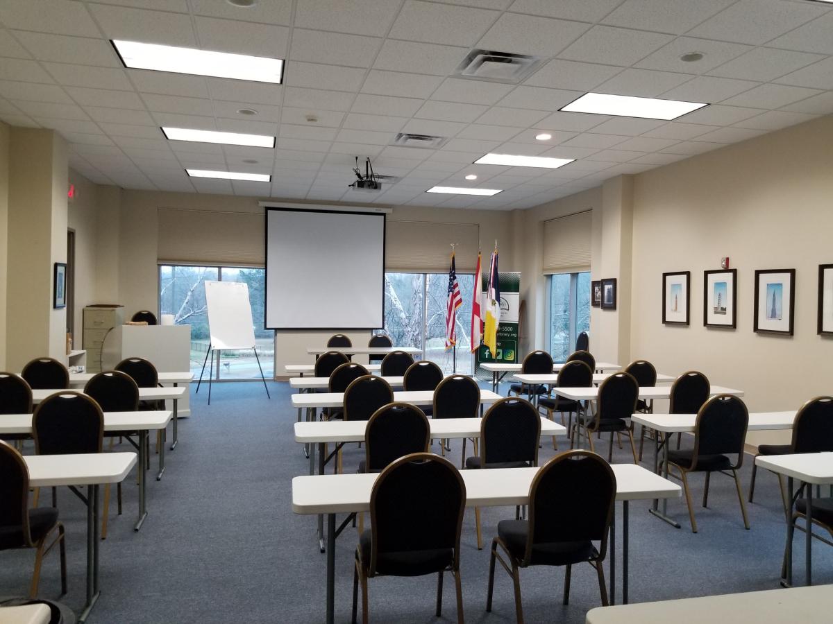 Picture of classroom with tables and chairs