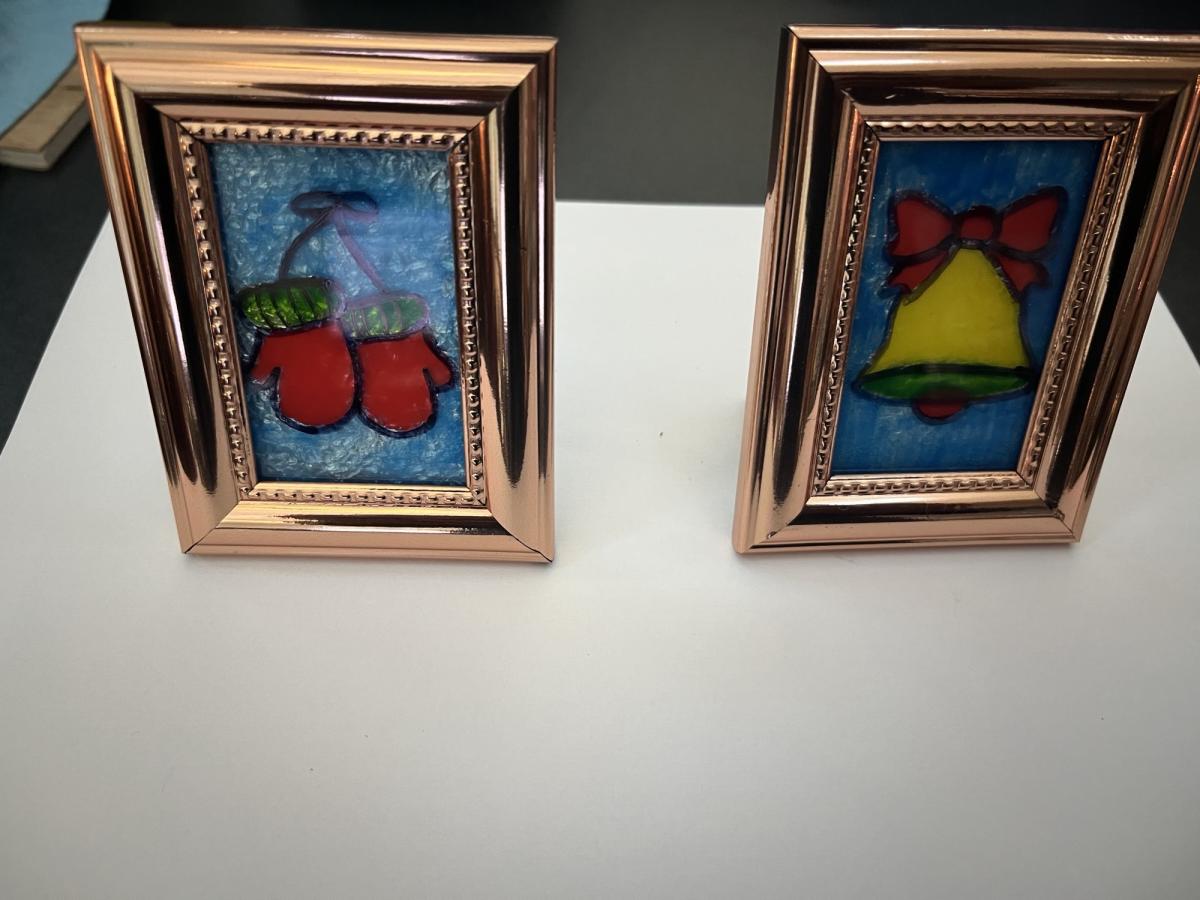 A picture of two faux stained glass art crafts
